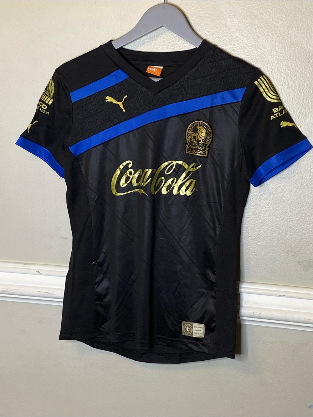 Puma women’s black & Blue Soccer Jersey with Gold Logos